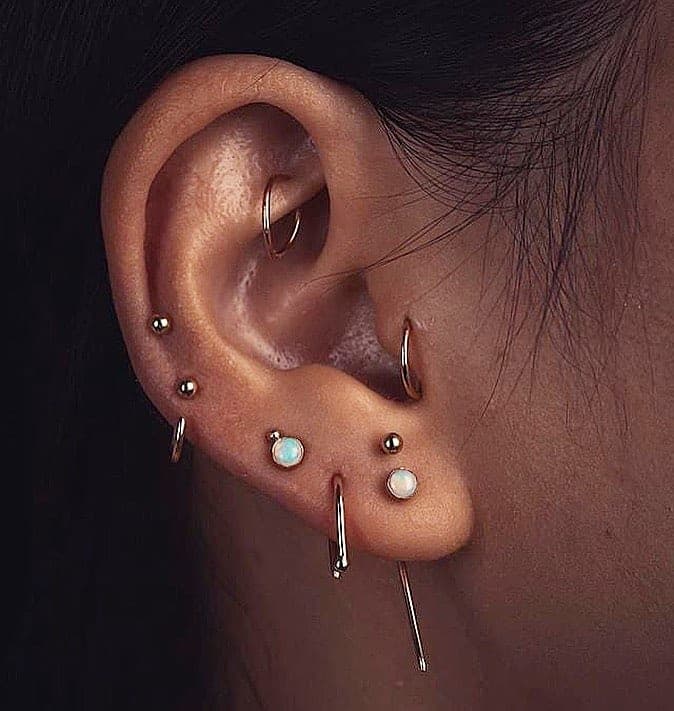 Piercing all'orecchio, lobo e cartilagine — Golden Skin Bergamo